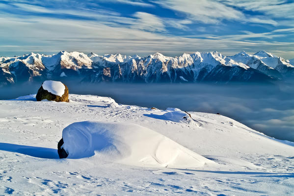 In Alpe Visogno the last lights of the sunset light the Orobian Alps in low Valtellina, Lombardy Italy Europe