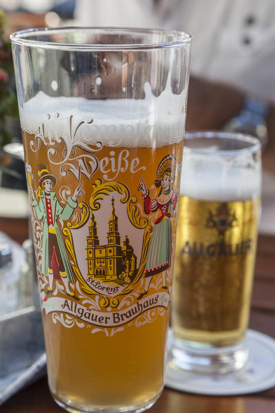 Details of decorated glasses of beer the typical German drink Garmisch Partenkirchen Oberbayern region Bavaria Germany Europe