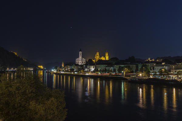 Night view of the old city with typical buildings and houses reflected in the river Passau Lower Bavaria Germany Europe