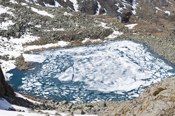 Ice and clear water at Lago Rotondo during thaw Val Malga Adamello Regional Park province of Brescia Lombardy Italy Europe