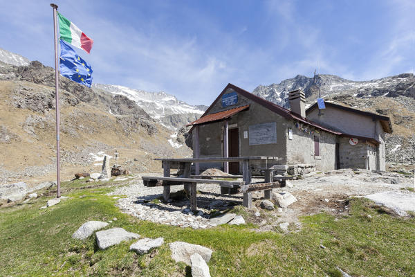 View of Rifugio Tonolini framed by the high peaks Val Malga Adamello Regional Park province of Brescia Lombardy Italy Europe