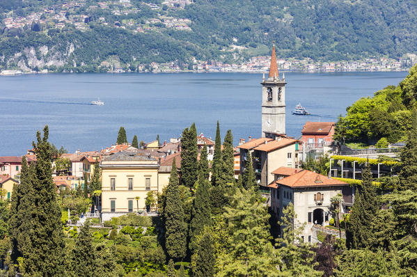 The typical village of Varenna surrounded by the blue water of Lake Como and gardens Province of Lecco Lombardy Italy Europe