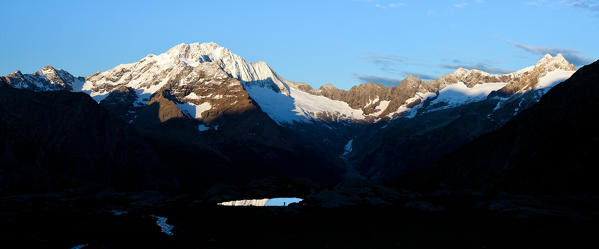 Dawn is one of the best moment for photographers: silhouette, light and shadow, reflecting lakes and snow-capped peaks, as the Mount Disgrazia in this example, are the perfect ingredients for a picture at this time of the day - Valmalenco Lombardy Italy Europe