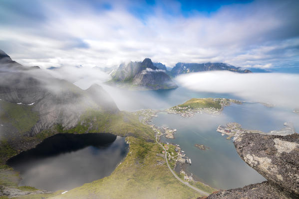 Top view of lakes and sea under the cloudy sky at summer Reinebringen Moskenes Lofoten Islands Norway Europe