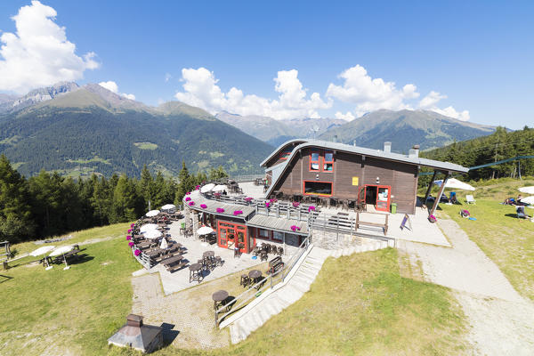 Blue sky frames the Rifugio Roccolo Ventura Ponte Di Legno Camonica Valley province of Brescia Lombardy Italy Europe