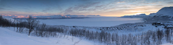 Panoramic of sunrise on the snowy landscape, Bjorkliden, Abisko, Kiruna Municipality, Norrbotten County, Lapland, Sweden