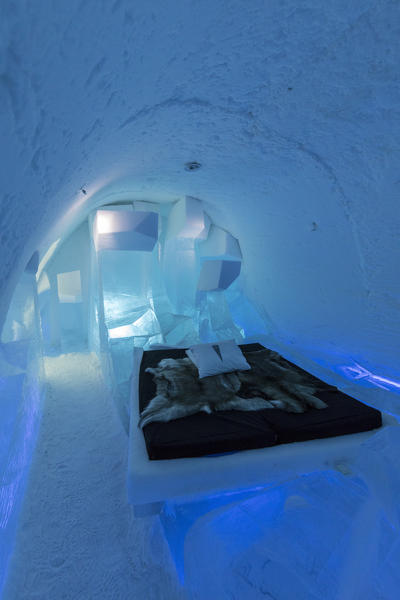 Illuminated double bed and sculptures, Ice Hotel, Jukkasjarvi, Kiruna Municipality, Norrbotten County, Lapland, Sweden