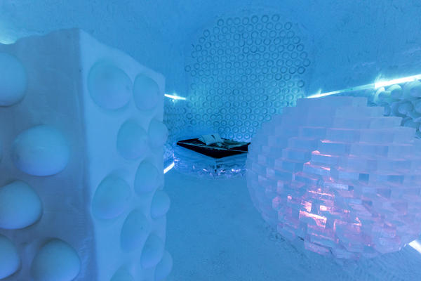 Illuminated double bed and sculptures, Ice Hotel, Jukkasjarvi, Kiruna, Norrbotten County, Lapland, Sweden