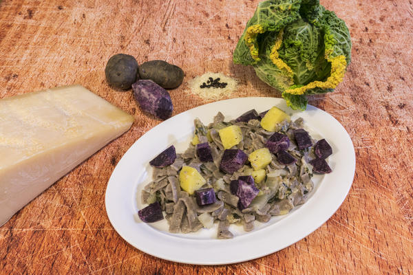 Plate of pizzoccheri with vegetables and cheese, San Romerio Alp, Brusio, Canton of Graubünden, Poschiavo valley, Switzerland