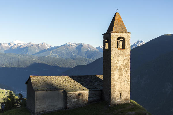 Ancient church perched on mountains, San Romerio Alp, Brusio, Canton of Graubünden, Poschiavo valley, Switzerland