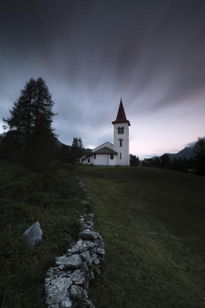 Dark clouds at sunset on Chiesa Bianca, Maloja, Bregaglia Valley, Canton of Graubünden, Engadin, Switzerland