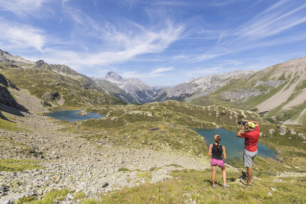 Photographers at lake Lejets during summer, Crap Alv, Albula Pass, canton of Graubünden, Switzerland