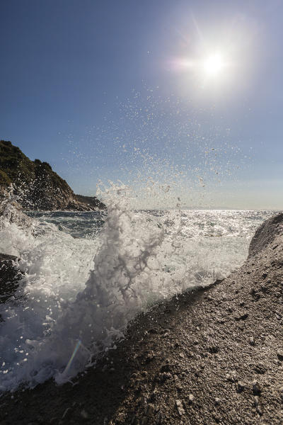 Waves crashing on rocks, Pomonte Beach, Marciana, Elba Island, Livorno Province, Tuscany, Italy