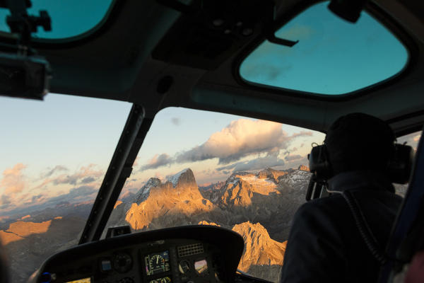 Interior of the cockpit of helicopter in flight on the Dolomites, South Tyrol, Italy