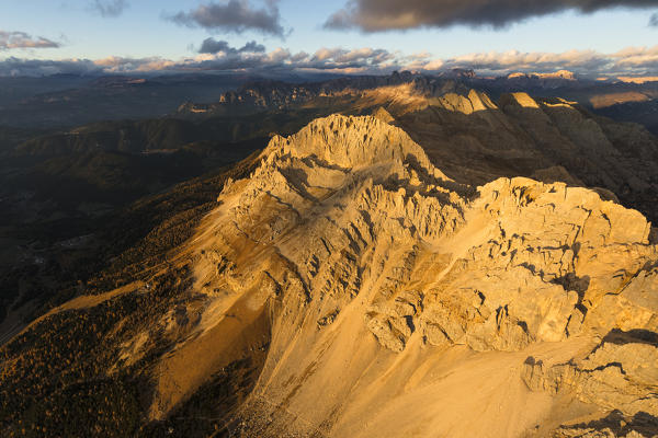 Aerial view of the rocky peaks of Latemar massif at sunset, Dolomites, South Tyrol, Italy