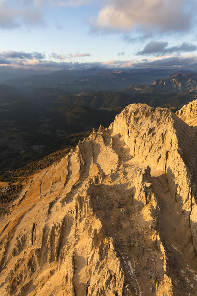 Aerial view of the rocky peaks of Latemar massif at sunset, Dolomites, South Tyrol, Italy