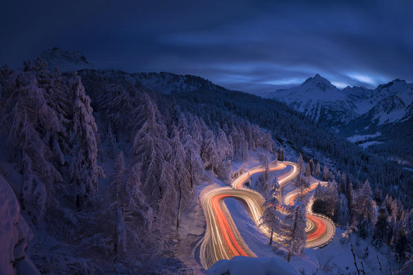 Panoramic of car lights at night, Maloja Pass, Engadin, canton of Graubunden, Switzerland