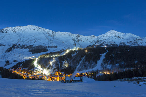 Illuminated ski area of Madesimo, Spluga Valley, province of Sondrio, Valtellina, Lombardy, Italy