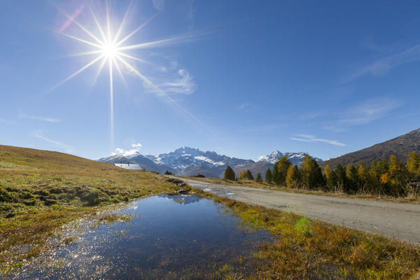 Sunburst on Cima Piazzi, Val Vezzola, Valdidentro, Valtellina, Sondrio province, Lombardy, Italy