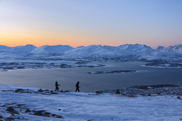 Hikers at dusk, Fjellheisen,Troms county, Norway