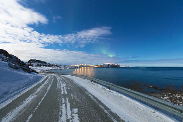 Ice on asphalt road, Sommaroy island, Troms county, Norway