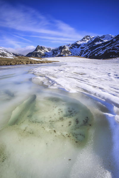 Spring thaw at Lake Andossi, Chiavenna Valley, Spluga Valley, Sondrio province, Valtellina, Lombardy, Italy