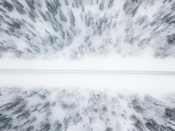 Aerial view of road in the snow covered forest, Pallas-Yllastunturi National Park, Muonio, Lapland, Finland