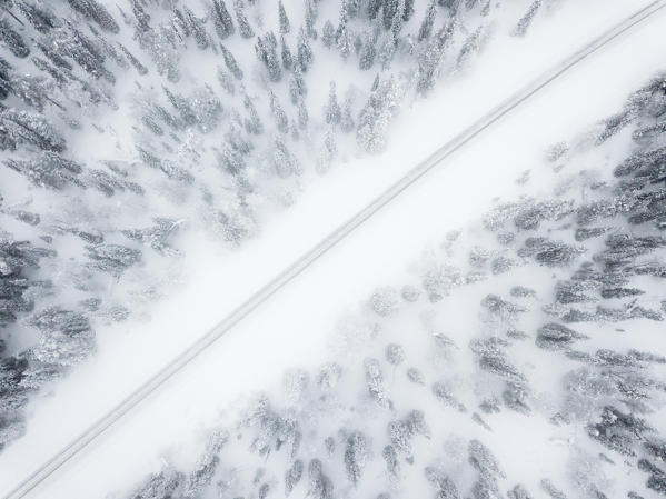 Aerial view of road in the snow covered forest, Pallas-Yllastunturi National Park, Muonio, Lapland, Finland