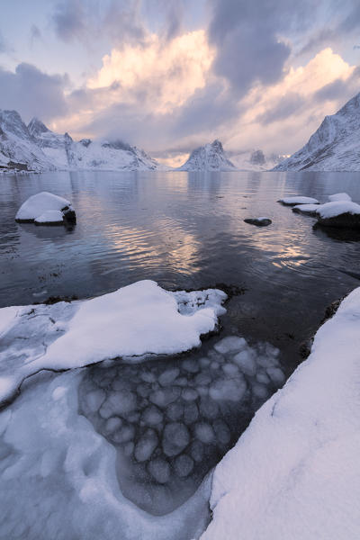 Sunset on the icy sea, Reine Bay, Lofoten Islands, Norway