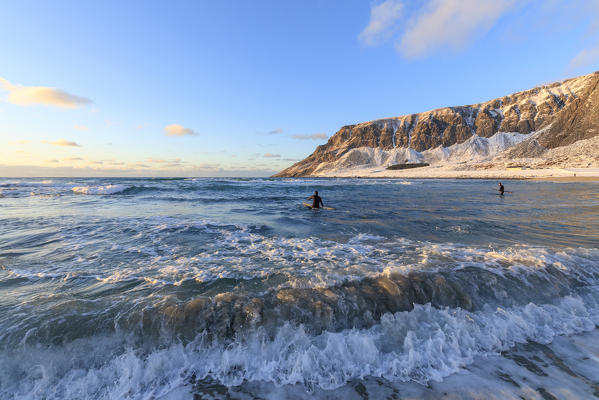 Surfers paddling , Unstad, Vestvagoy, Lofoten Islands, Norway