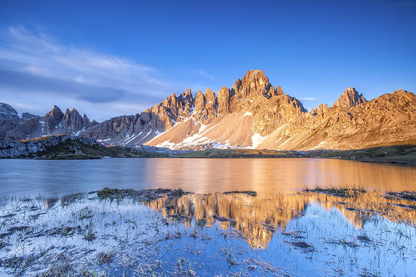 Mount Paterno reflecting in the Lake Piani by Locatelli Refuge at sunrise. Sesto Dolomites. Independent province of Bolzano. Veneto. Italy. Europe