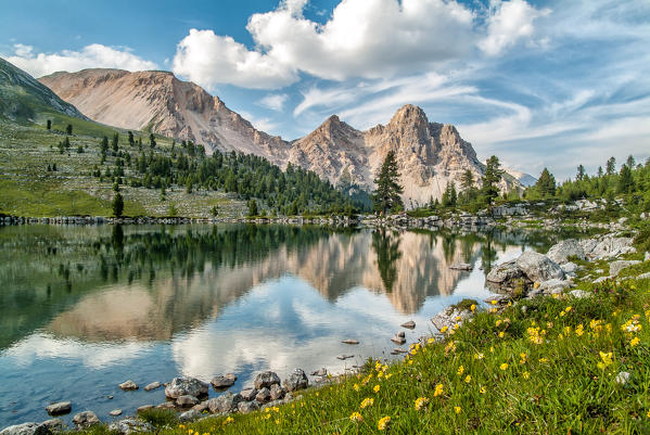 The calm water of the Lake Verde reflecting the Dolomite peaks of the Furcia dei Fers in the Fanes Natural Park, Seines, Braies, Alps, independent province of Bolzano, South Tirol, Trentino Alto-Adige, Italy Europe