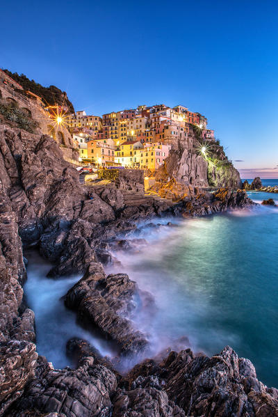 The lights of Manarola at the blue hour - Cinque Terre National Park, Liguria Italy Europe