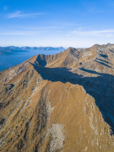 Aerial view of the rocky crest of Sasso Bianco during autumn, Valmalenco, Valtellina, Lombardy, Italy