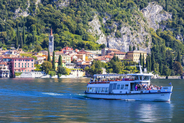 People on boat trip around the village of Varenna, Lake Como, Lecco province, Lombardy, Italy