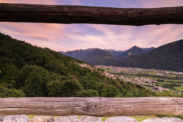 Village of Mello seen from wood fence of Castello di Domofole, Costiera dei Cech, Sondrio province, Valtellina, Lombardy, Italy