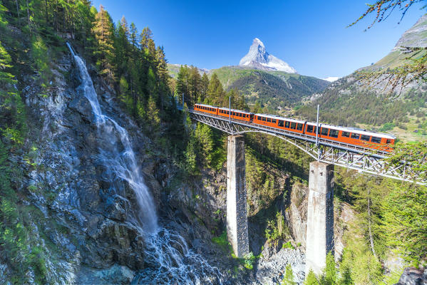 Gornergrat Bahn train on viaduct with Matterhorn on background, Zermatt, canton of Valais, Switzerland