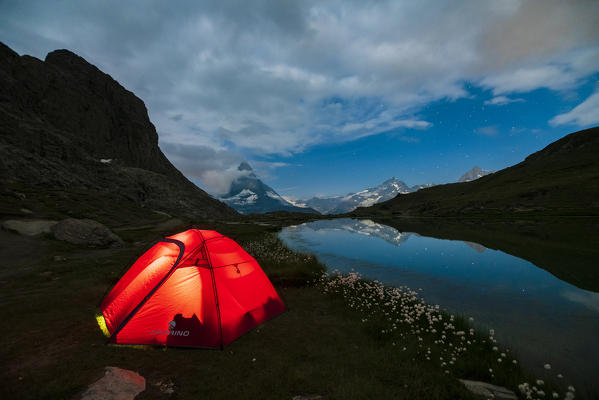 Tent on the shore of lake Riffelsee facing Matterhorn, Zermatt, canton of Valais, Switzerland