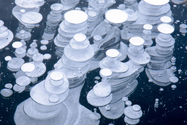 Close up of details and shapes of ice bubbles, Lake St Moritz, canton of Graubunden, Engadine, Switzerland