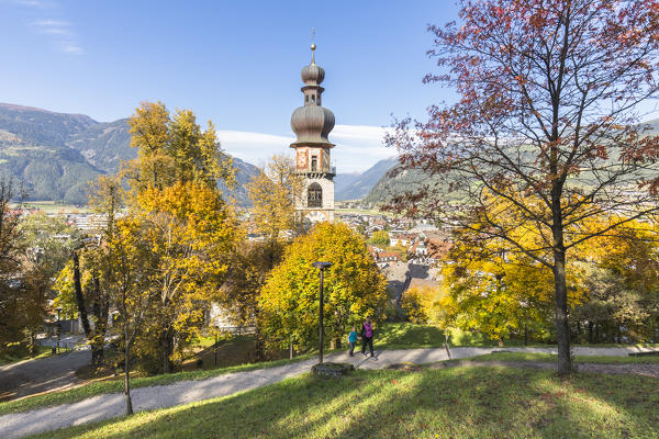 An autumnal view of the Bruneck, with the bell tower in the typical tyrolean style, Bolzano province, South Tyrol, Trentino Alto Adige, Italy