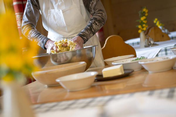 a Chef is mixing the ingredients to preparing the dumplings, Bolzano province, South Tyrol, Trentino Alto Adige, Italy, 