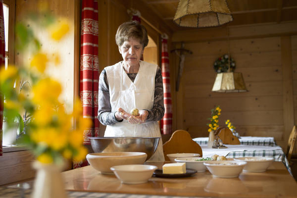a chef show a finished handmade dumpling, (canederlo, Bolzano province, South Tyrol, Trentino Alto Adige, Italy