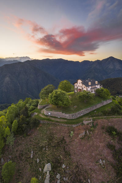 The Sanctuary of San Bernardo at sunset, in the background the Monte Rosa (Oasi Zegna natural area, Valdilana, Biella province, Piedmont, Italy, Europe)