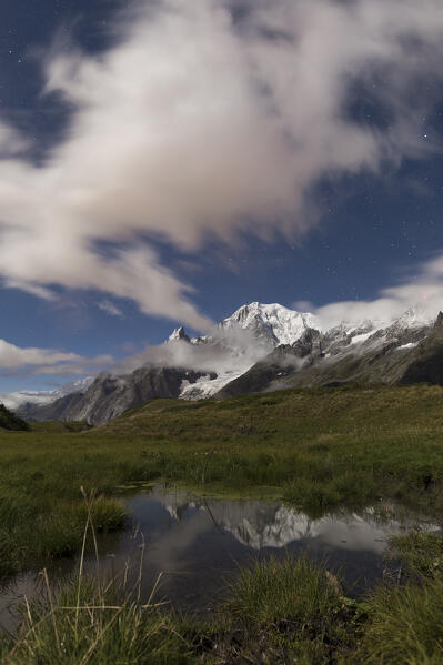 The Mont Blanc during a full moon night (Alp Lechey, Ferret Valley, Courmayeur, Aosta province, Aosta Valley, Italy, Europe)