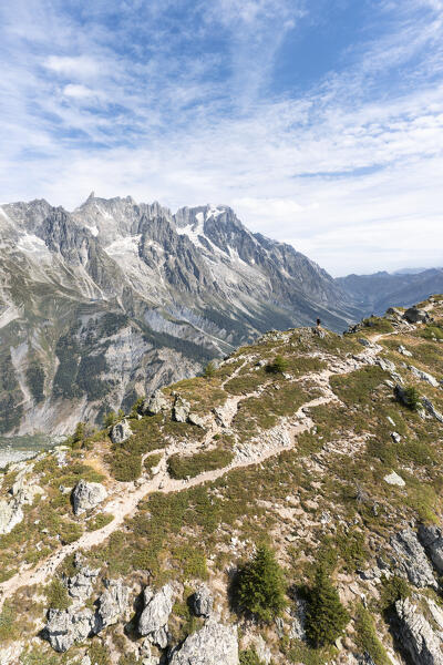 A man at the top of the Mont Chétif in front of Mont Blanc Massif (Veny Valley, Courmayeur, Aosta province, Aosta Valley, Italy, Europe)