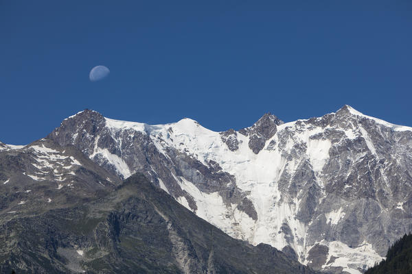 View of the East face of Monte Rosa Massif(Punta Gnifetti, Zumstein, Dufour and Nordend) from Anzasca Valley,  (Ceppo Morelli, Verbano Cusio Ossola province, Piedmont, Italy, Europe)