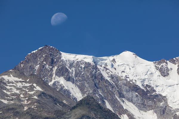 View of the East face of Monte Rosa Massif (Punta Gnifetti and Zumstein) from Anzasca Valley (Ceppo Morelli, Verbano Cusio Ossola province, Piedmont, Italy, Europe)