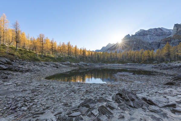 The Nero Lake in autumn at sunset (Buscagna Valley, Alpe Devero, Alpe Veglia and Alpe Devero Natural Park, Baceno, Verbano Cusio Ossola province, Piedmont, Italy, Europe)