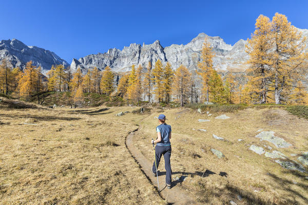 A girl is walking near the Nero Lake in the Alpe Veglia and Alpe Devero Natural Park (Buscagna Valley, Alpe Devero, Baceno, Verbano Cusio Ossola province, Piedmont, Italy, Europe) (MR)