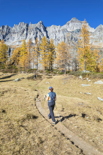 A girl is walking near the Nero Lake in the Alpe Veglia and Alpe Devero Natural Park (Buscagna Valley, Alpe Devero, Baceno, Verbano Cusio Ossola province, Piedmont, Italy, Europe) (MR)